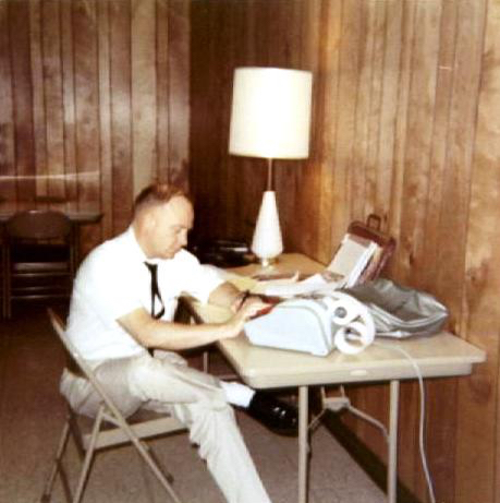 a man in the chair and the table calculating numbers