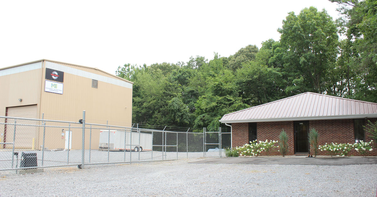 Massey Electric warehouse and brick building next to it